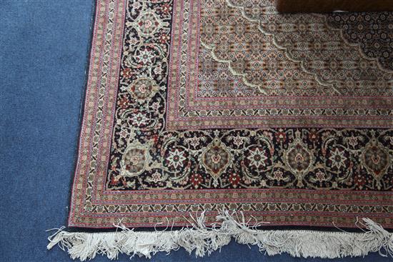 A central Persian carpet, 10ft by 6ft 8in.